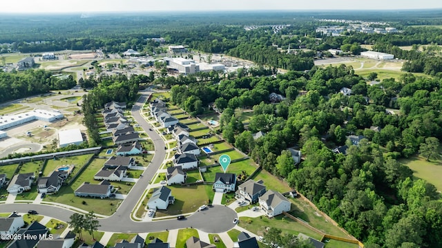 view of property location featuring a forest
