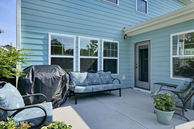 view of patio / terrace featuring a grill and an outdoor hangout area