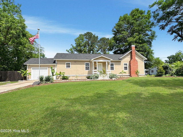 402 Warren St, Williamston, NC 27892 - ranch-style house featuring concrete driveway, a chimney, a garage, and covered porch