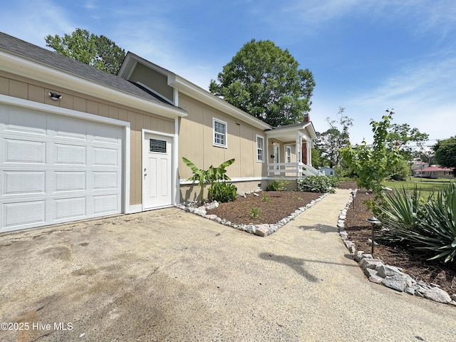 402 Warren St, Williamston, NC 27892 - view of front of property featuring driveway, an attached garage, and a porch
