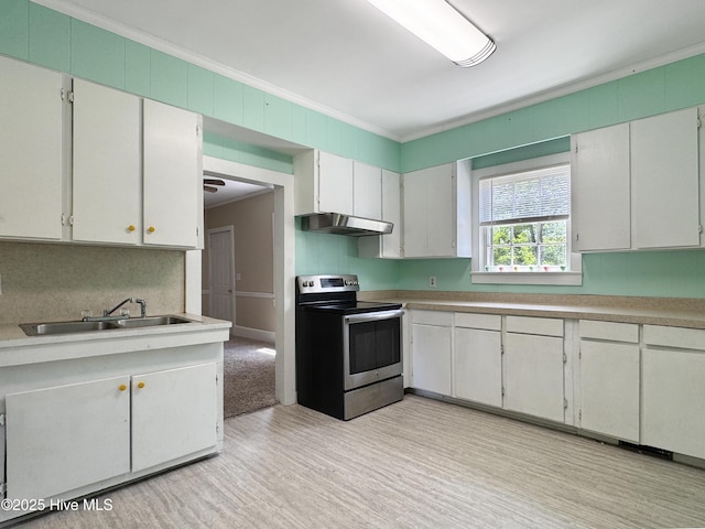 402 Warren St, Williamston, NC 27892 - kitchen with stainless steel range with electric cooktop, crown molding, a sink, under cabinet range hood, and light wood finished floors