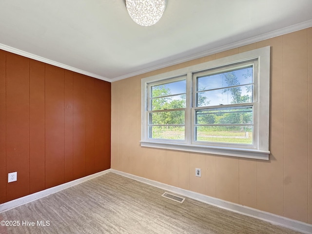 402 Warren St, Williamston, NC 27892 - unfurnished room with baseboards, crown molding, and a chandelier
