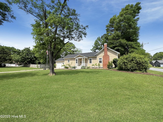 402 Warren St, Williamston, NC 27892 - ranch-style home with a chimney and a garage