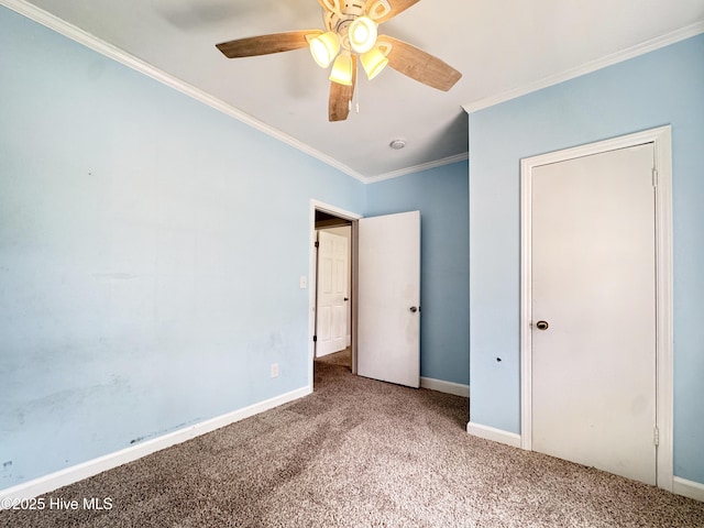 402 Warren St, Williamston, NC 27892 - unfurnished bedroom featuring carpet, ornamental molding, baseboards, and ceiling fan