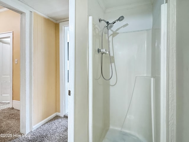 402 Warren St, Williamston, NC 27892 - bathroom featuring a shower, baseboards, and crown molding