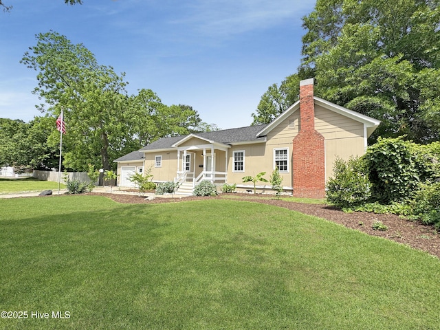 402 Warren St, Williamston, NC 27892 - view of front of property featuring a chimney, an attached garage, and a shingled roof