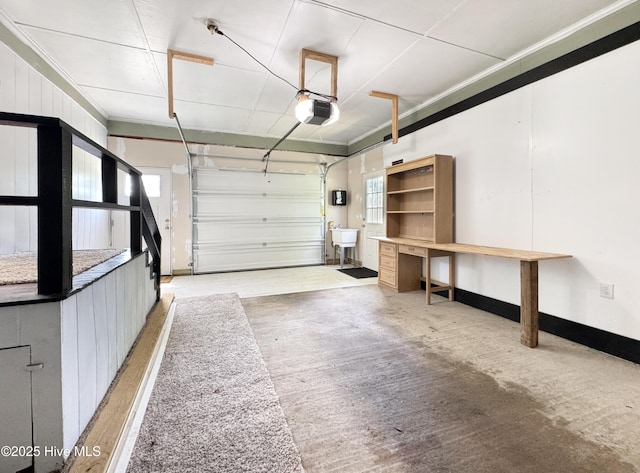 402 Warren St, Williamston, NC 27892 - garage with a garage door opener, a sink, and baseboards