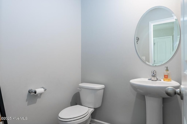 308 Isabelle St Lot # 986, New Bern, NC 28560 - bathroom featuring toilet, baseboards, and a sink