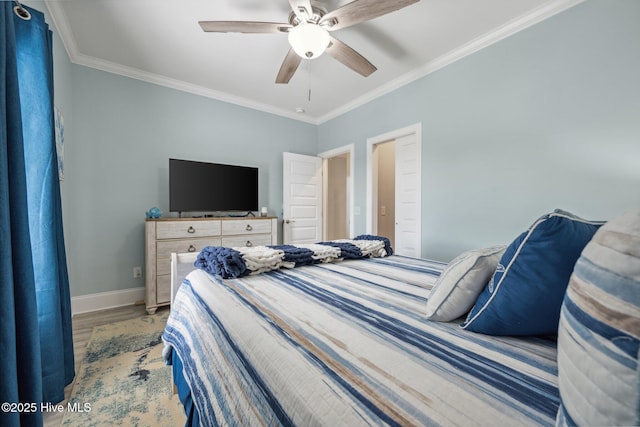 152 NW 1st St, Oak Island, NC 28465 - bedroom with crown molding, wood finished floors, baseboards, and ceiling fan