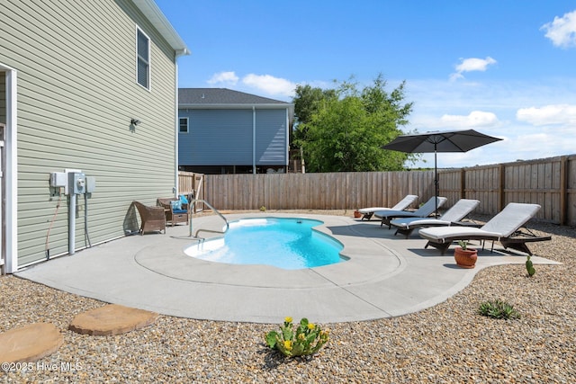 152 NW 1st St, Oak Island, NC 28465 - view of swimming pool featuring a patio and a fenced backyard