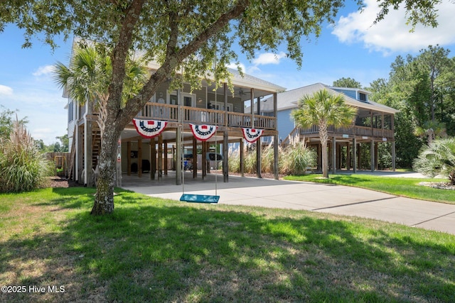 152 NW 1st St, Oak Island, NC 28465 - view of building exterior with stairs