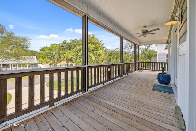 152 NW 1st St, Oak Island, NC 28465 - deck with a ceiling fan