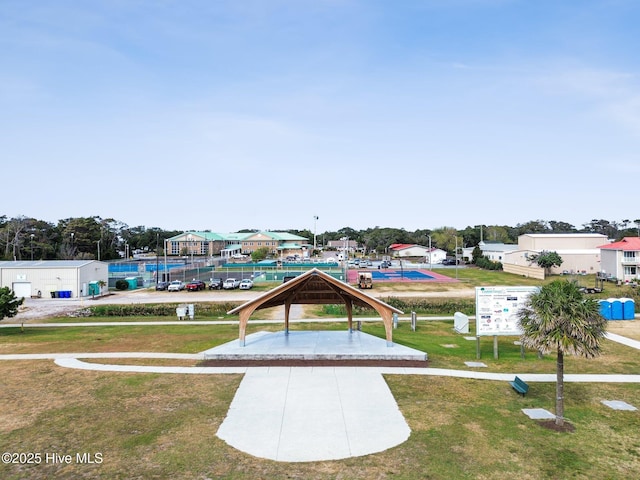 152 NW 1st St, Oak Island, NC 28465 - view of property's community with a lawn