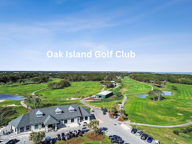 152 NW 1st St, Oak Island, NC 28465 - drone / aerial view of a nearby body of water, a local golf course, and a tree filled landscape