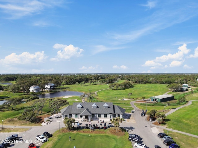 152 NW 1st St, Oak Island, NC 28465 - drone / aerial view of a nearby body of water, a golf course, and a tree filled landscape
