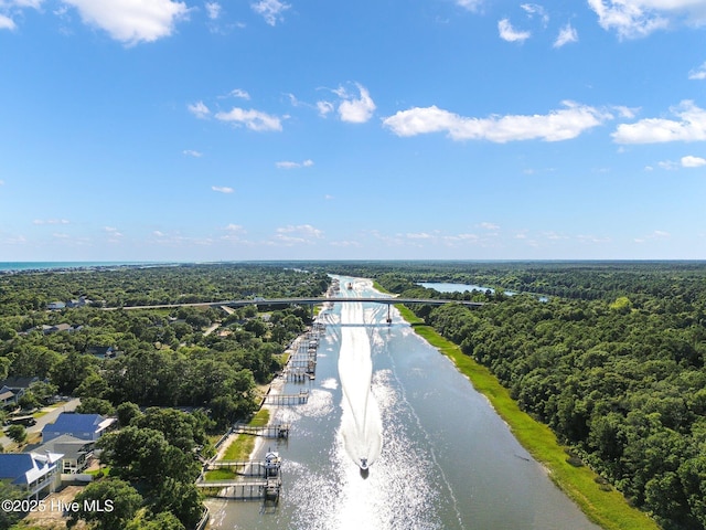 152 NW 1st St, Oak Island, NC 28465 - aerial view of a notable bridge, a nearby body of water, and a heavily wooded area