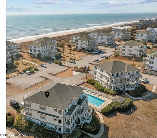 aerial view of expansive coastline and a pool area