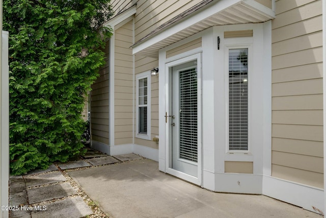 entrance to property with a patio area