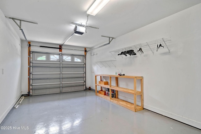 garage featuring a garage door opener and baseboards