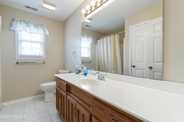 bathroom featuring tile patterned flooring, baseboards, toilet, vanity, and curtained shower