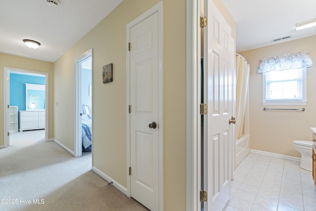corridor featuring baseboards
