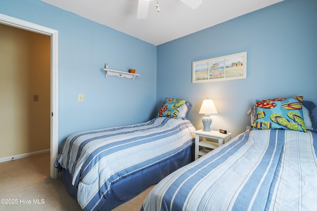 bedroom featuring carpet, baseboards, and ceiling fan