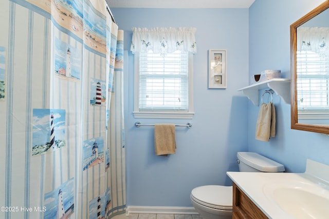 bathroom featuring healthy amount of natural light, toilet, vanity, and a shower with curtain