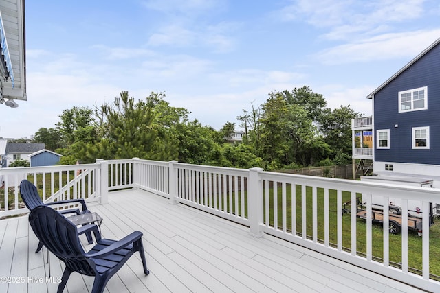 wooden deck with a yard