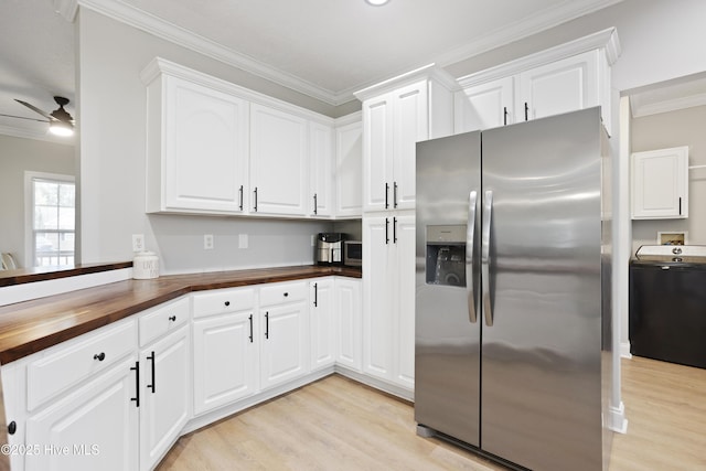 kitchen featuring stainless steel refrigerator with ice dispenser, butcher block countertops, washer / clothes dryer, ornamental molding, and light wood-style flooring