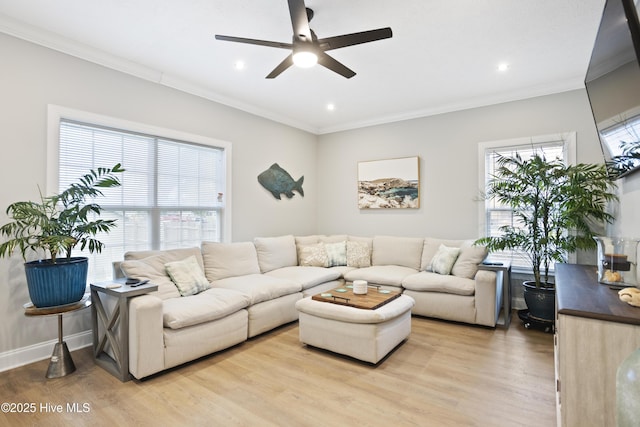 living room featuring light wood-style flooring, ceiling fan, ornamental molding, recessed lighting, and baseboards