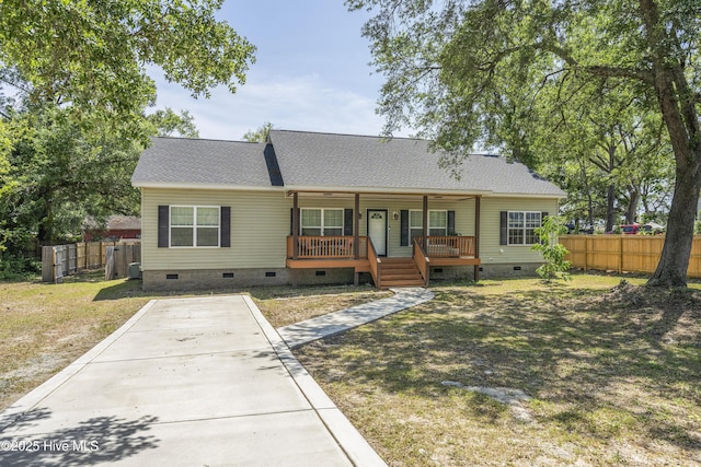 view of front of property with crawl space, a porch, and a shingled roof