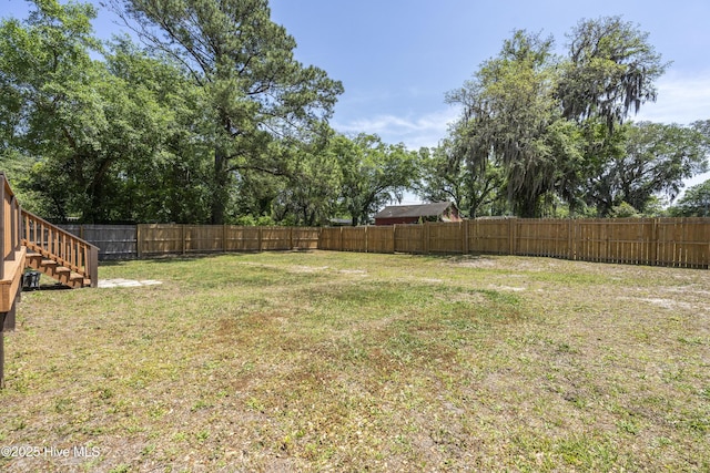 view of yard featuring stairway