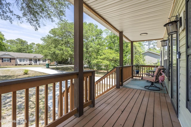 wooden deck featuring a porch