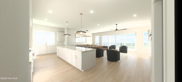 L15R Shipyard Ln, Hampstead, NC 28443 - kitchen featuring a center island, white cabinets, ceiling fan, recessed lighting, and light wood-type flooring
