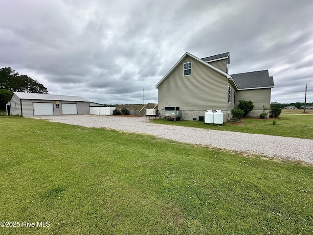 146 N Ravenwood Ln, Belhaven, NC 27810 - view of home's exterior with an outbuilding, a lawn, driveway, and a garage