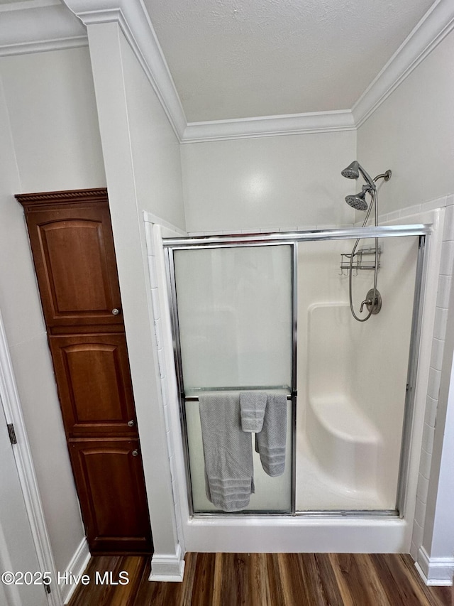 146 N Ravenwood Ln, Belhaven, NC 27810 - bathroom featuring a shower stall, wood finished floors, and ornamental molding