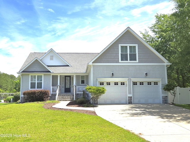 105 Argosy Dr, New Bern, NC 28560 - craftsman-style home featuring a porch, stone siding, concrete driveway, an attached garage, and roof with shingles