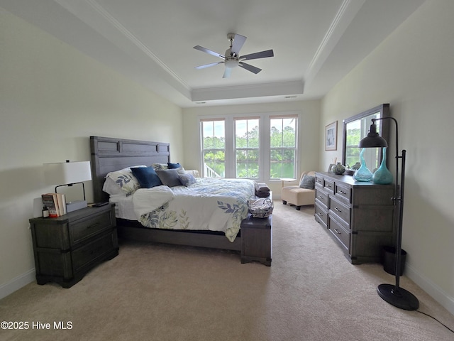 105 Argosy Dr, New Bern, NC 28560 - bedroom featuring light colored carpet, a tray ceiling, ornamental molding, baseboards, and a ceiling fan