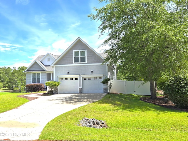 105 Argosy Dr, New Bern, NC 28560 - craftsman-style home featuring stone siding, a garage, concrete driveway, and a gate