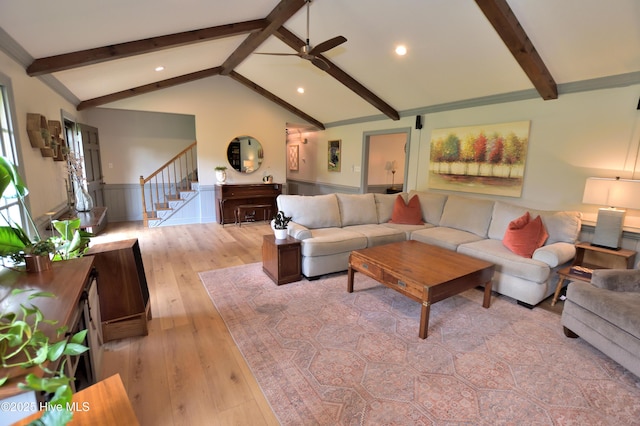 living area featuring stairway, wainscoting, recessed lighting, ceiling fan, and light wood-style flooring