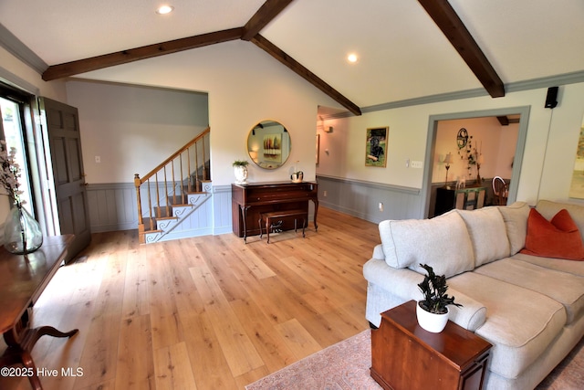 living room with a wainscoted wall, stairway, wood finished floors, recessed lighting, and a decorative wall