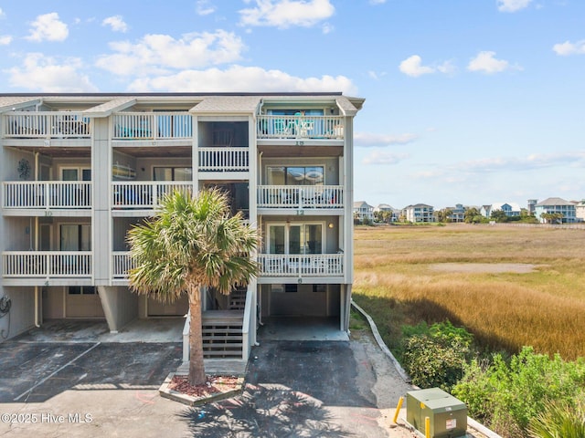1801 Canal Dr Unit C6, Carolina Beach, NC 28428 - view of property featuring driveway and an attached garage