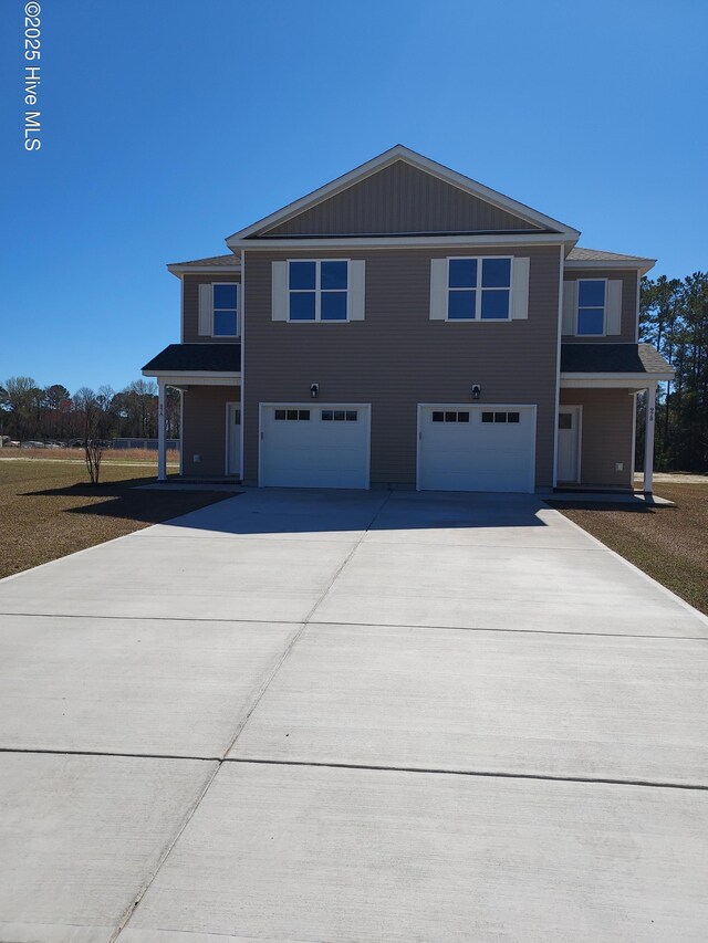97 Hadnot Dr Unit B, Swansboro, NC 28584 - view of front facade featuring a garage and driveway