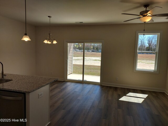 97 Hadnot Dr Unit B, Swansboro, NC 28584 - unfurnished dining area with dark wood-style flooring, a ceiling fan, baseboards, and a sink
