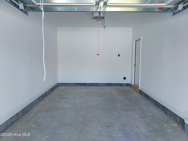 97 Hadnot Dr Unit B, Swansboro, NC 28584 - garage featuring a garage door opener and baseboards