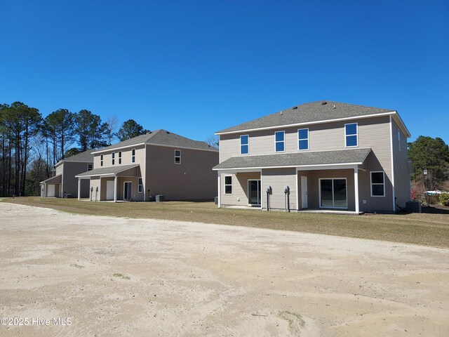 97 Hadnot Dr Unit B, Swansboro, NC 28584 - rear view of house featuring central AC unit