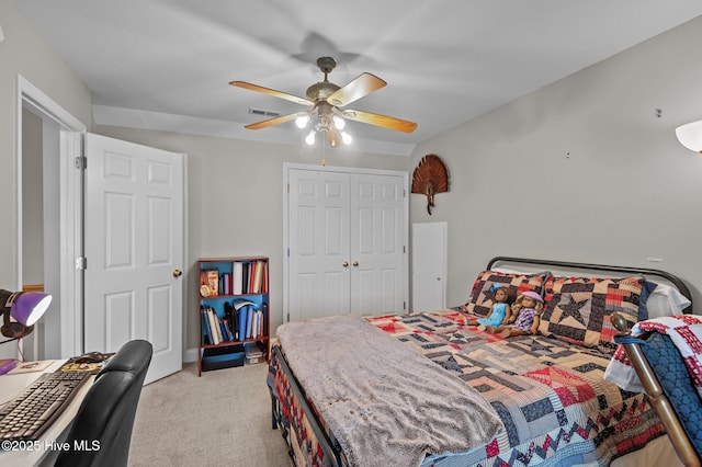 bedroom featuring light carpet, a closet, and ceiling fan