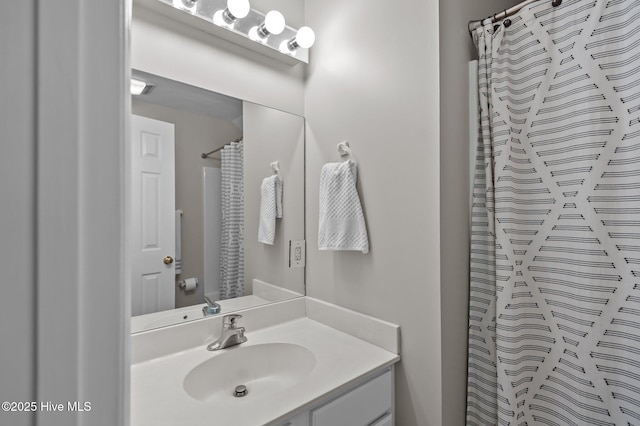 bathroom with vanity and a shower with curtain