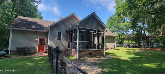 view of front facade with a sunroom and crawl space