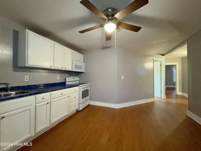 909 4th St, Elizabeth City, NC 27909 - kitchen featuring white appliances, a sink, dark wood-type flooring, baseboards, and ceiling fan